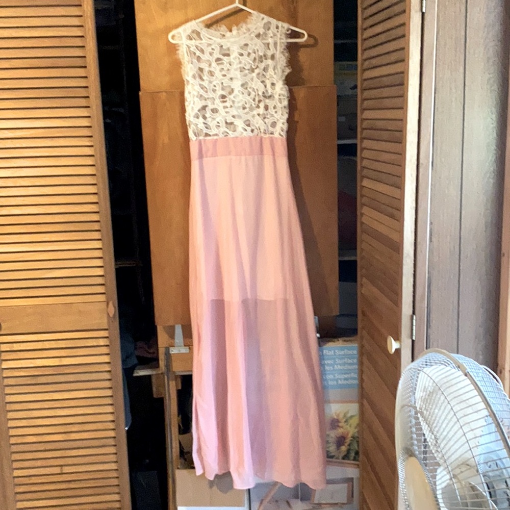 It is a small fit and a gorgeous dress for a summer day